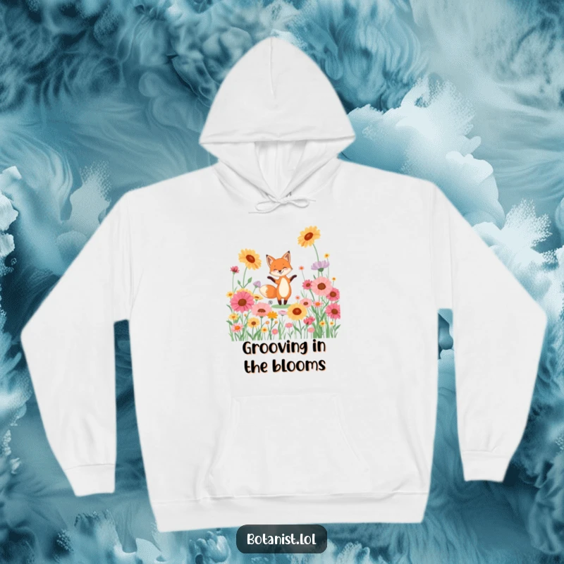 Funny hoodie with a playful fox performing a lively dance surrounded by enormous, vivid wildflowers.