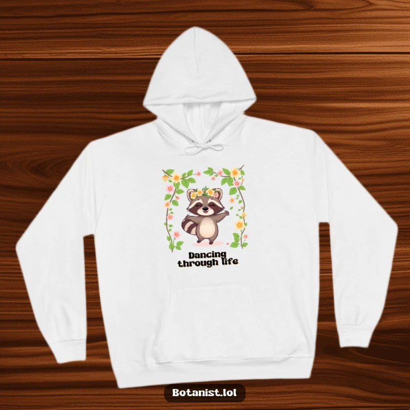 Funny raccoon hoodie showing a giggling raccoon wearing a flower crown and dancing among blooming vines, designed for festive fun.