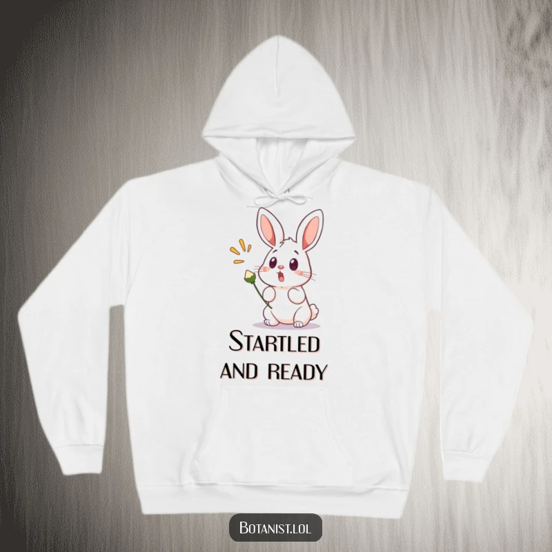 Funny hoodie depicting a surprised bunny with wide eyes and ears perked, startled by a seed pod that's popping, evoking a humorous reaction.