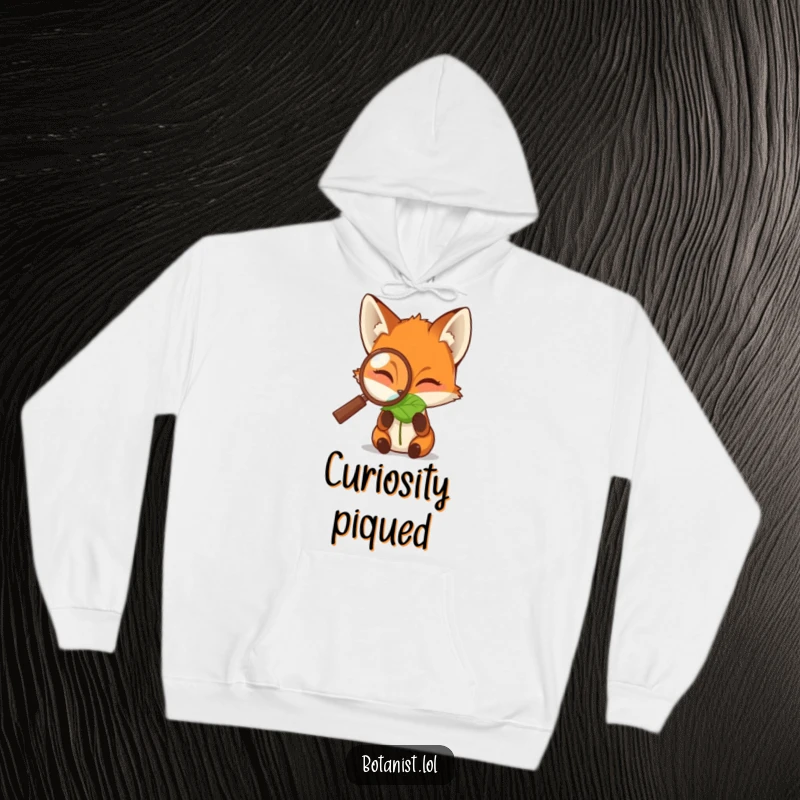 Funny hoodie depicting a fox peering through a magnifying glass at a dewdropped leaf, a cozy and intellectually stimulating design.