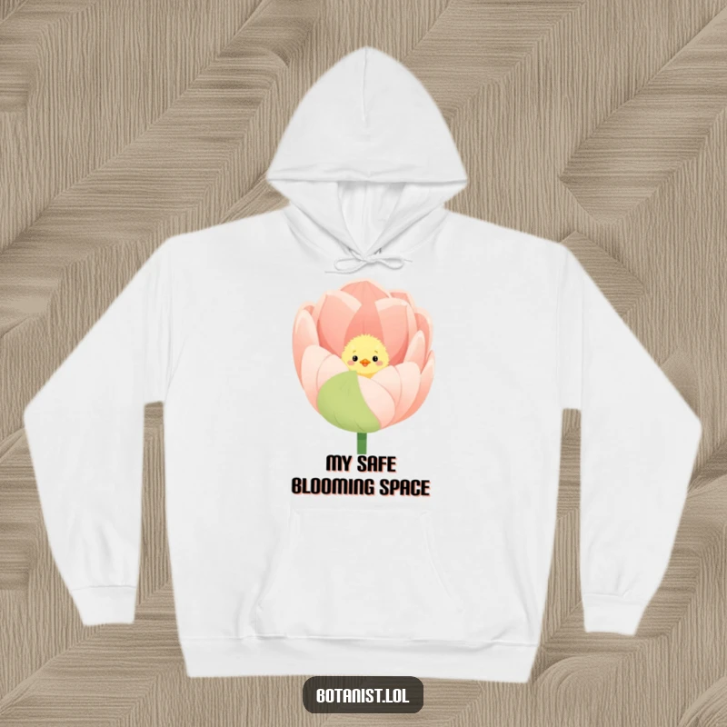 Funny hoodie depicting a fluffy chick peeking out from the vibrant petals of a giant, blooming tulip.