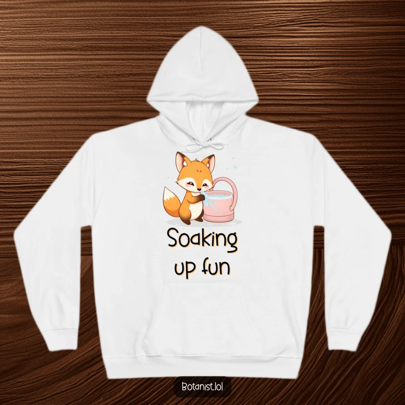 Funny curious fox hoodie, investigating bubbly water from a watering can, offering cozy comfort and playful humor.