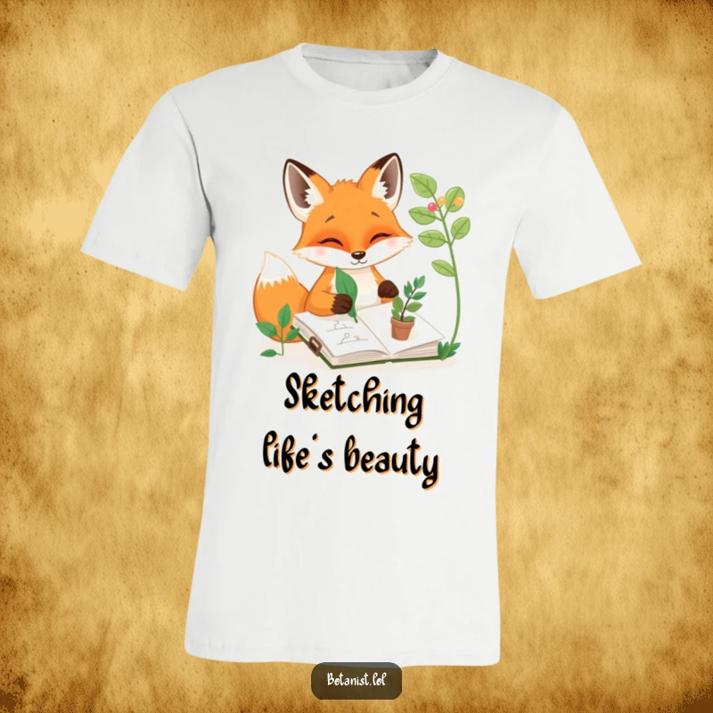 Funny t-shirt depicting a happy fox engrossed in sketching plants in a sketchbook, using a leaf as a tool, a fun art gift.